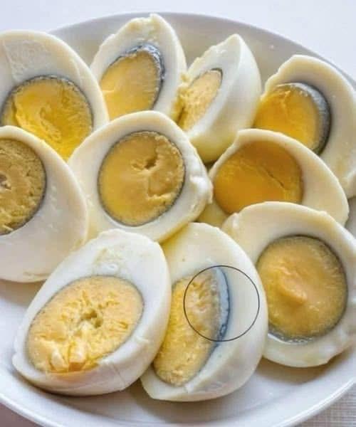 Why does a green ring appear around hard-boiled eggs?