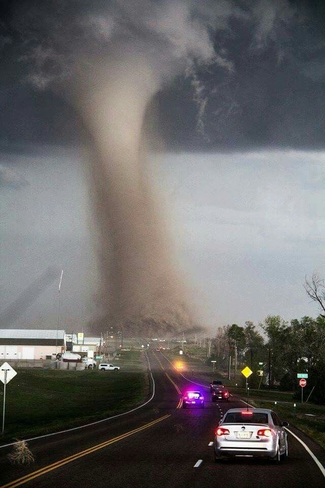 This is NOT normal… tornado crossing the road