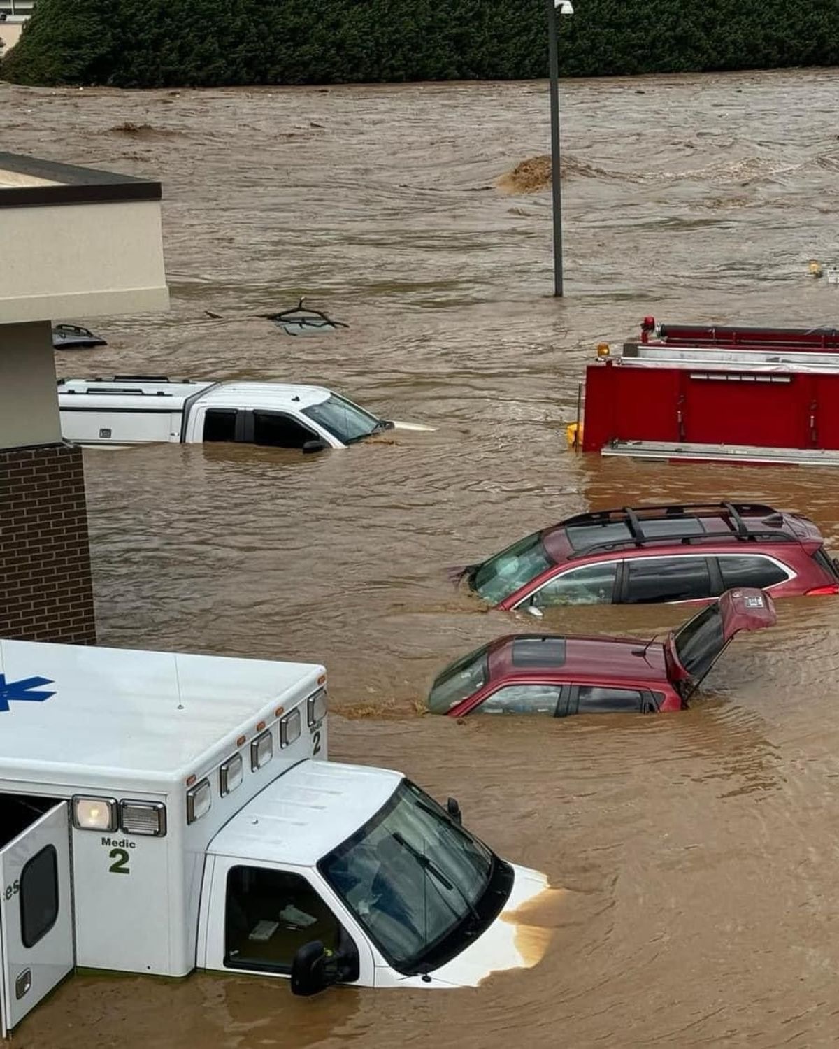 Cars disappearing under rising water…